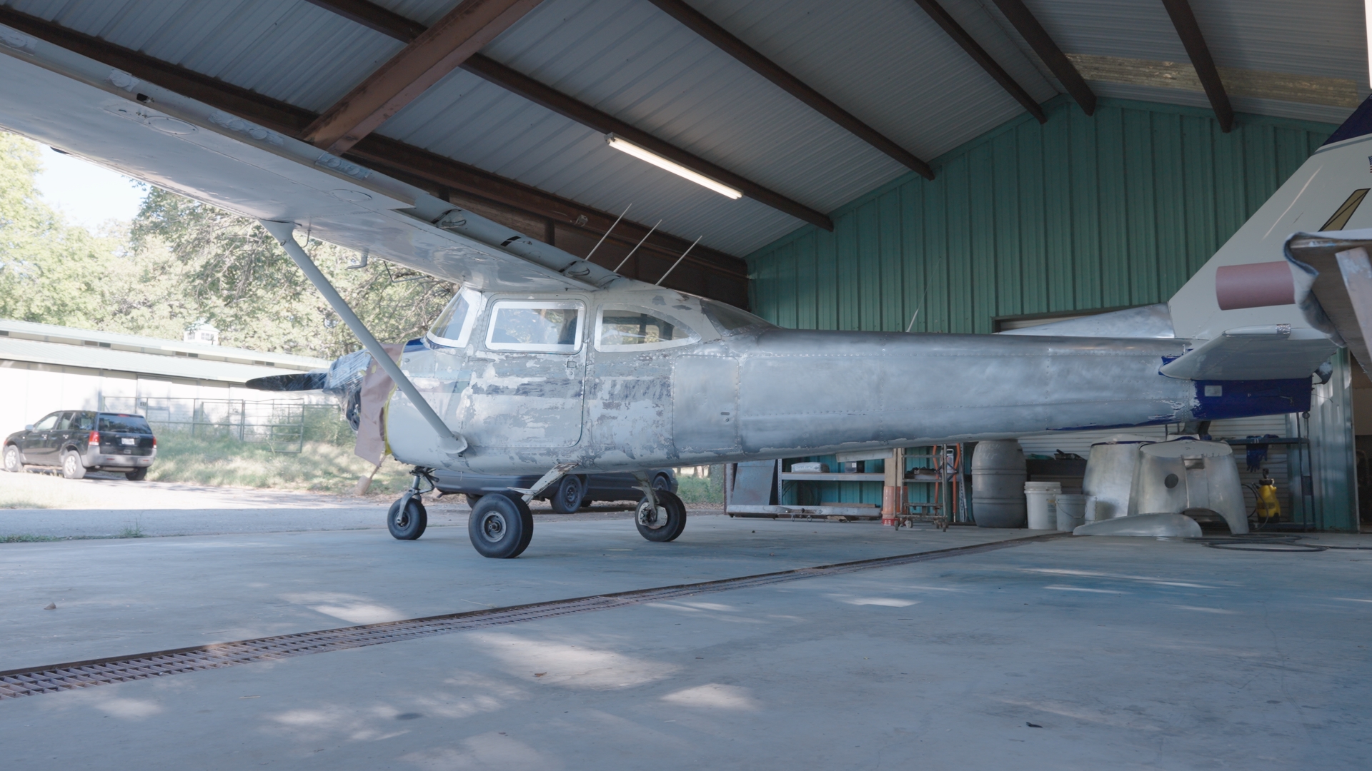 N35715 stripped — aircraft in the hangar, all paint removed